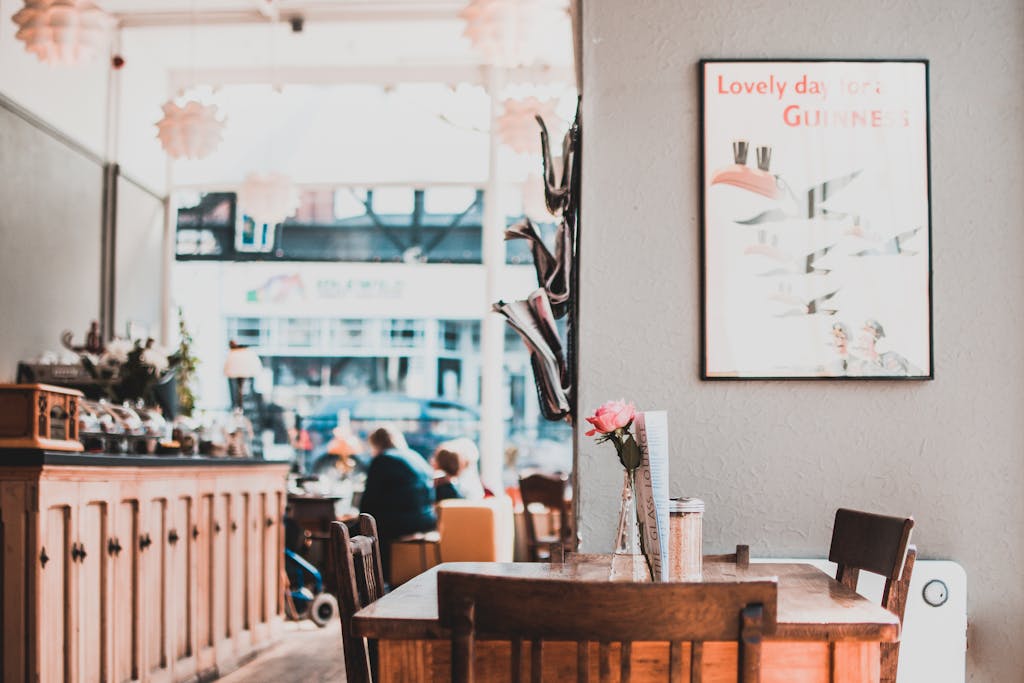 A charming café interior showcasing wooden furniture, warm lighting, and cozy atmosphere.